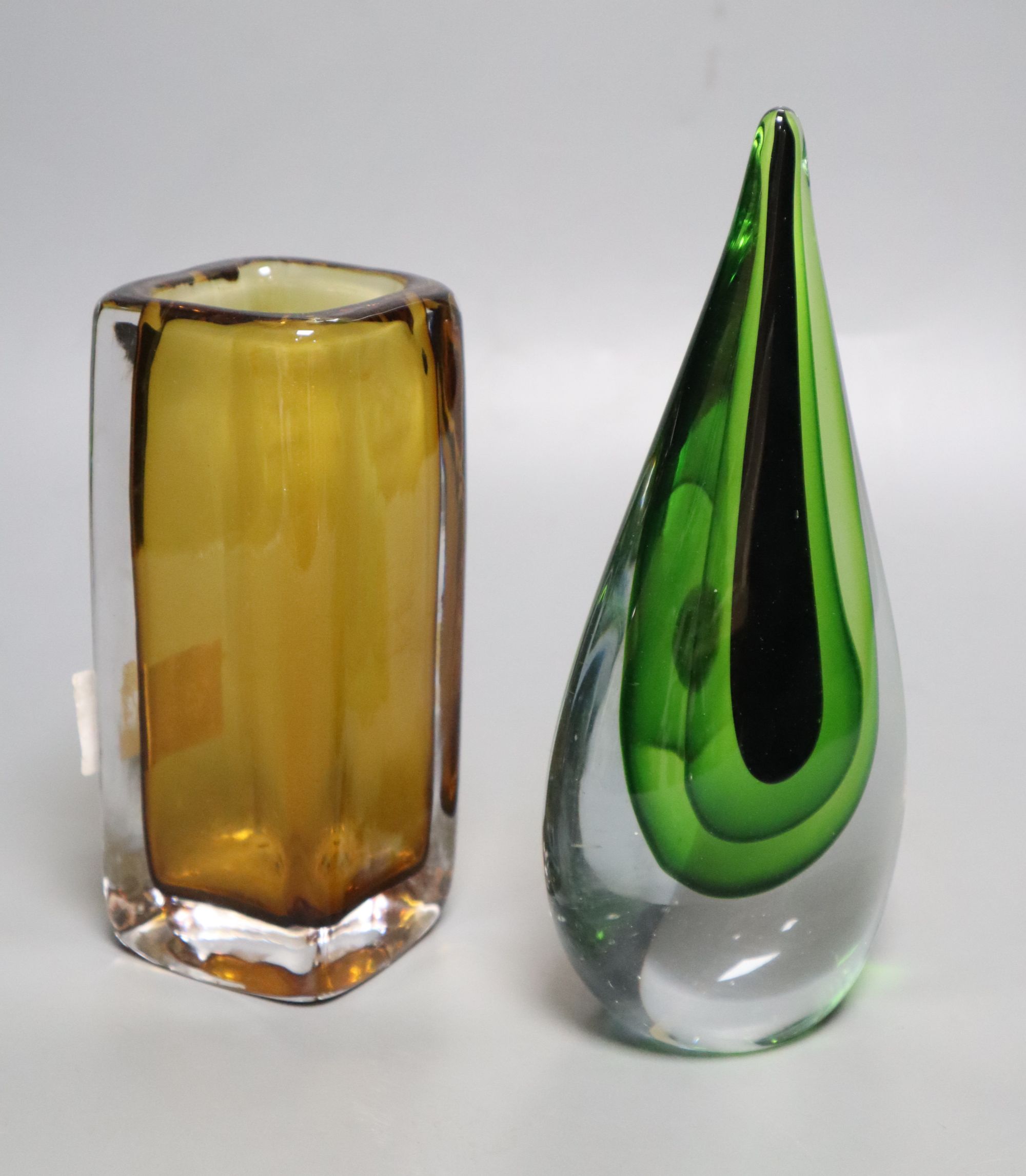 A Kosta amber glass vase and a green and clear glass ornament